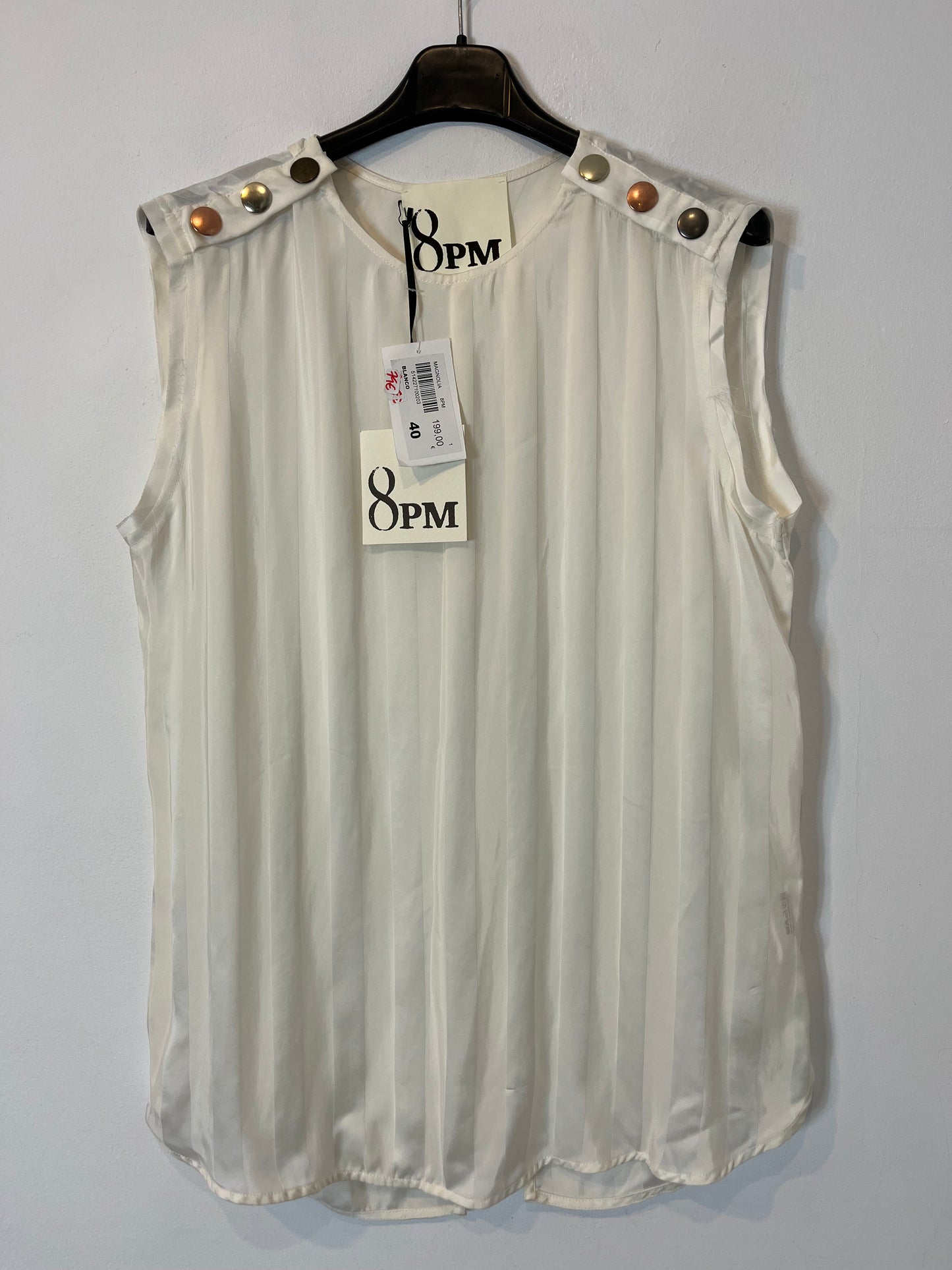 8 PM. Flowy top with striped back detail. TM/L