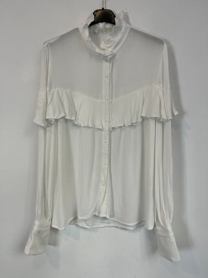 NAME THE BRAND. White ruffled blouse. TL