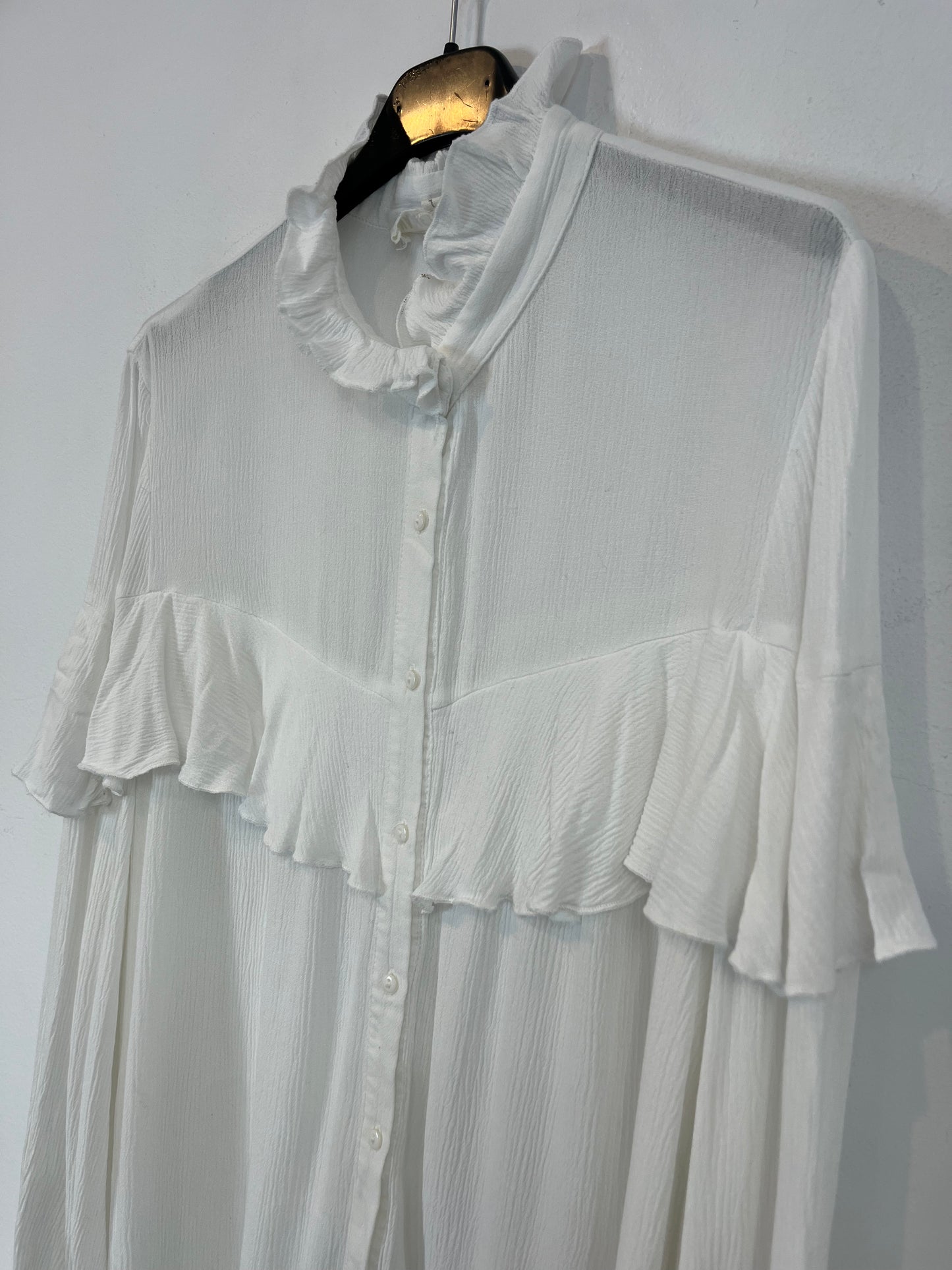 NAME THE BRAND. White ruffled blouse. TL
