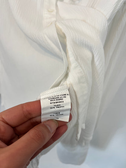 NAME THE BRAND. White ruffled blouse. TL