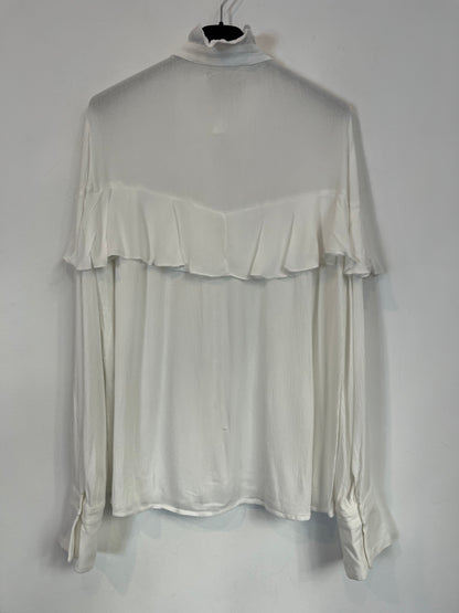 NAME THE BRAND. White ruffled blouse. TL