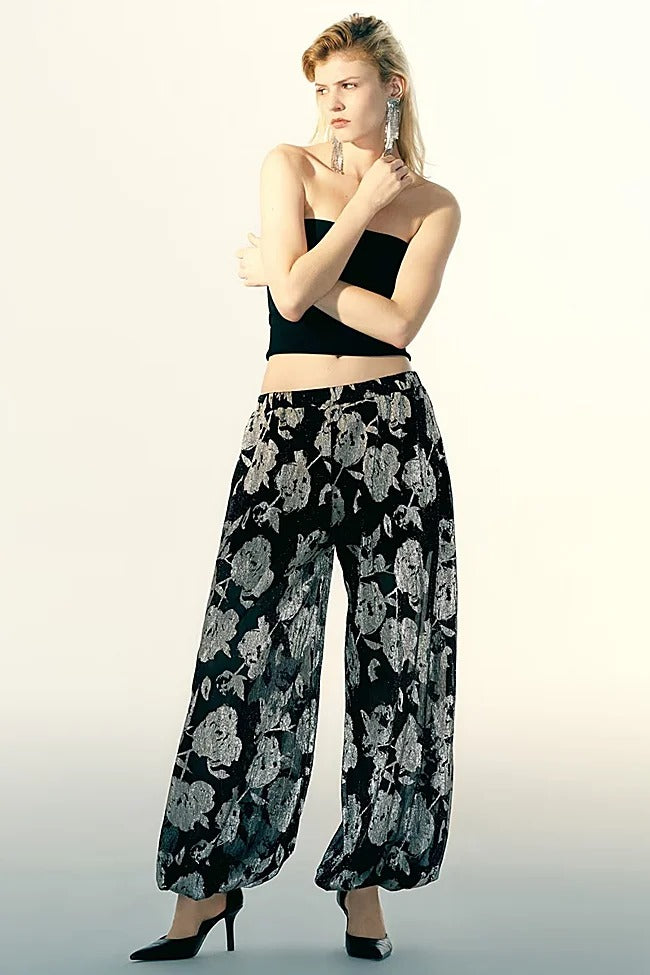 SFERA. Pantalón bombacho textura detalle semi transparente