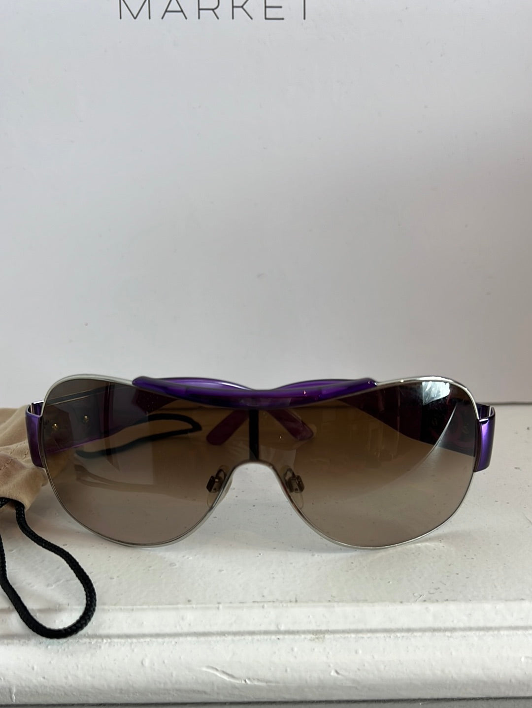 CHANEL. Purple-rimmed glasses