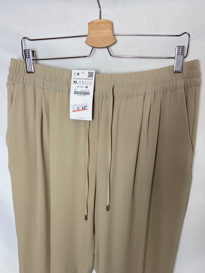 ZARA. Pantalón fluido beige T. XL