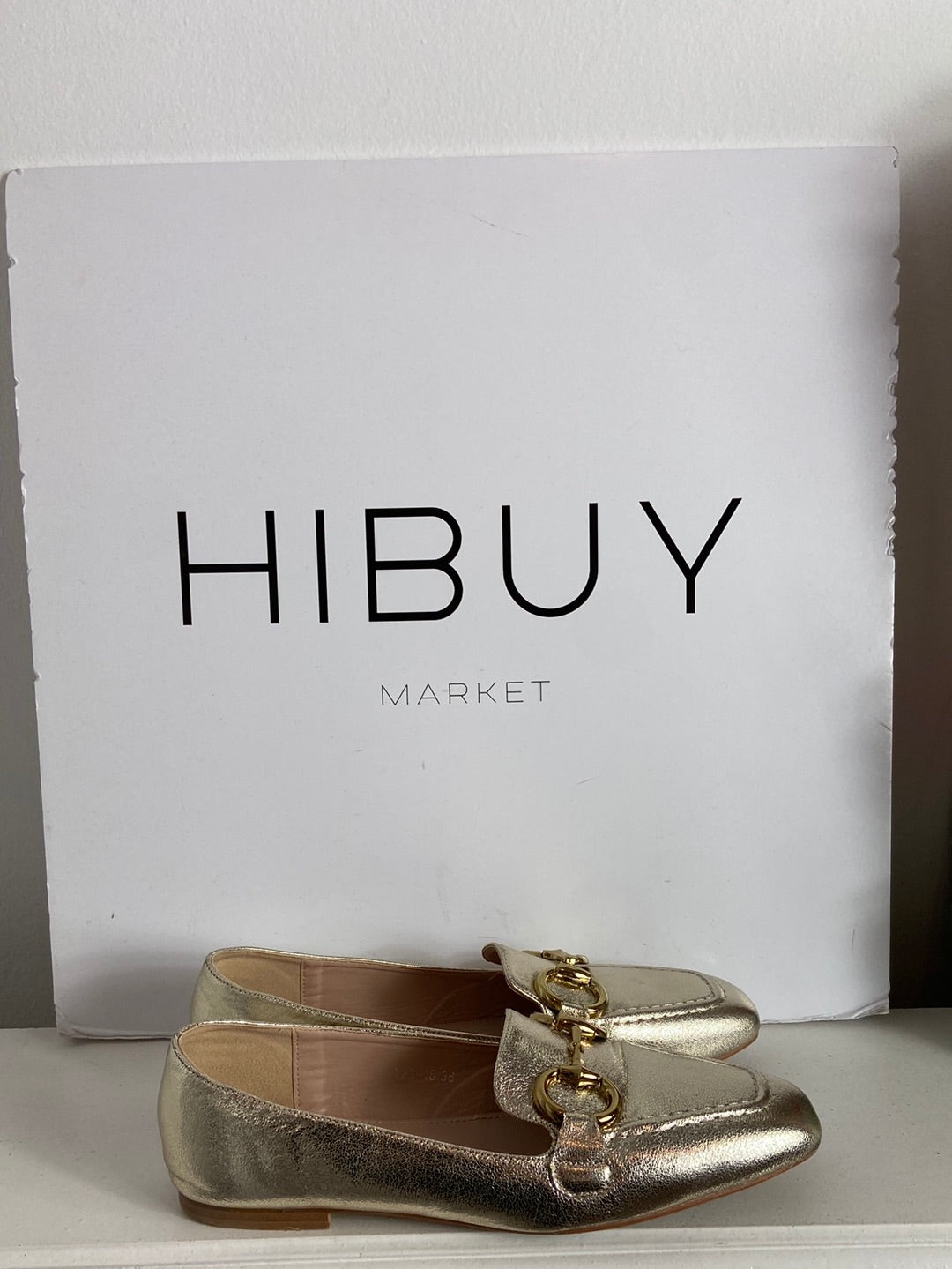 FINDLAY. Gold-tone loafers with buckle detail, size 38