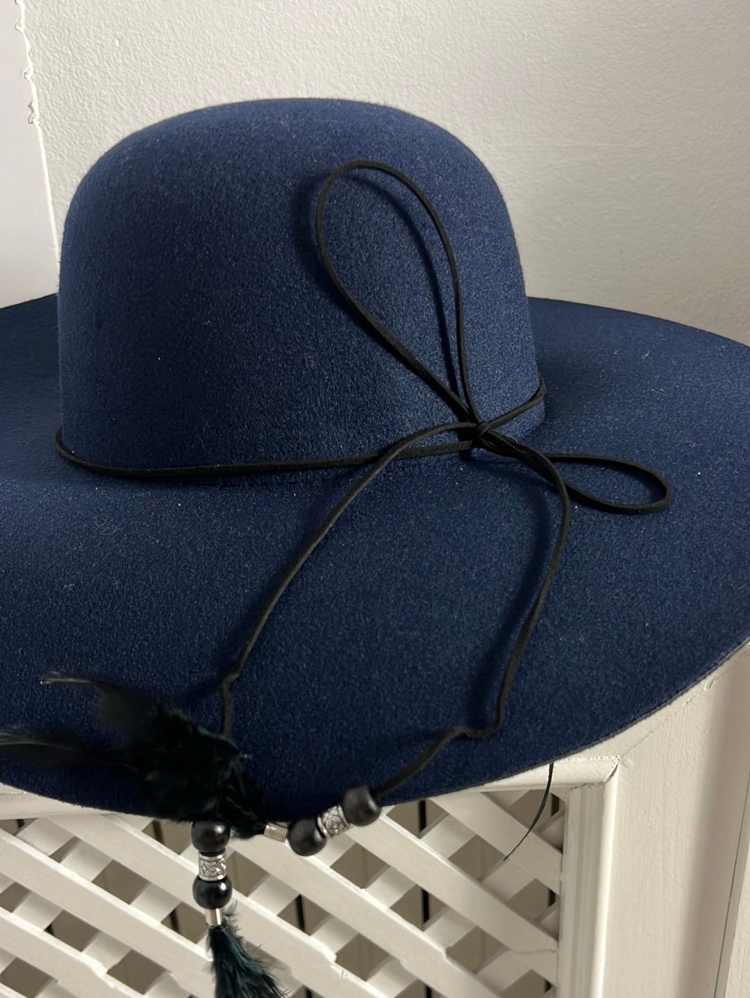 OTHERS. Blue hat with feather detail. T 57
