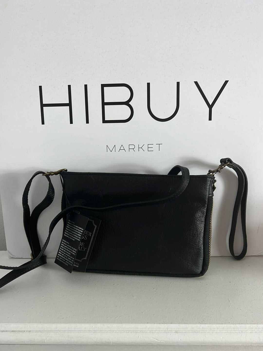 OTRAS. Bolso de mano de piel doble textura