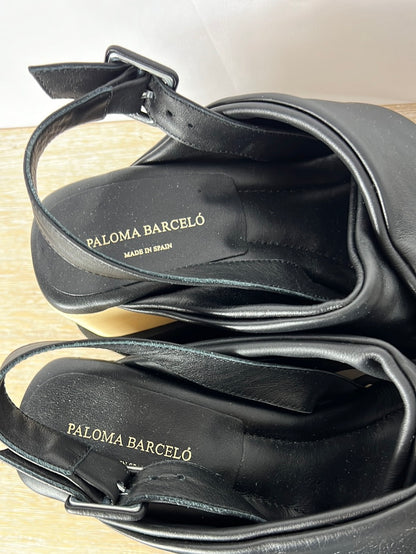 PALOMA BARCELÓ. Plataformas tira cruzada negra. T 39