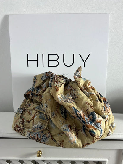 OTRAS. Bolso tipo saco estampado con cremallera (tara)