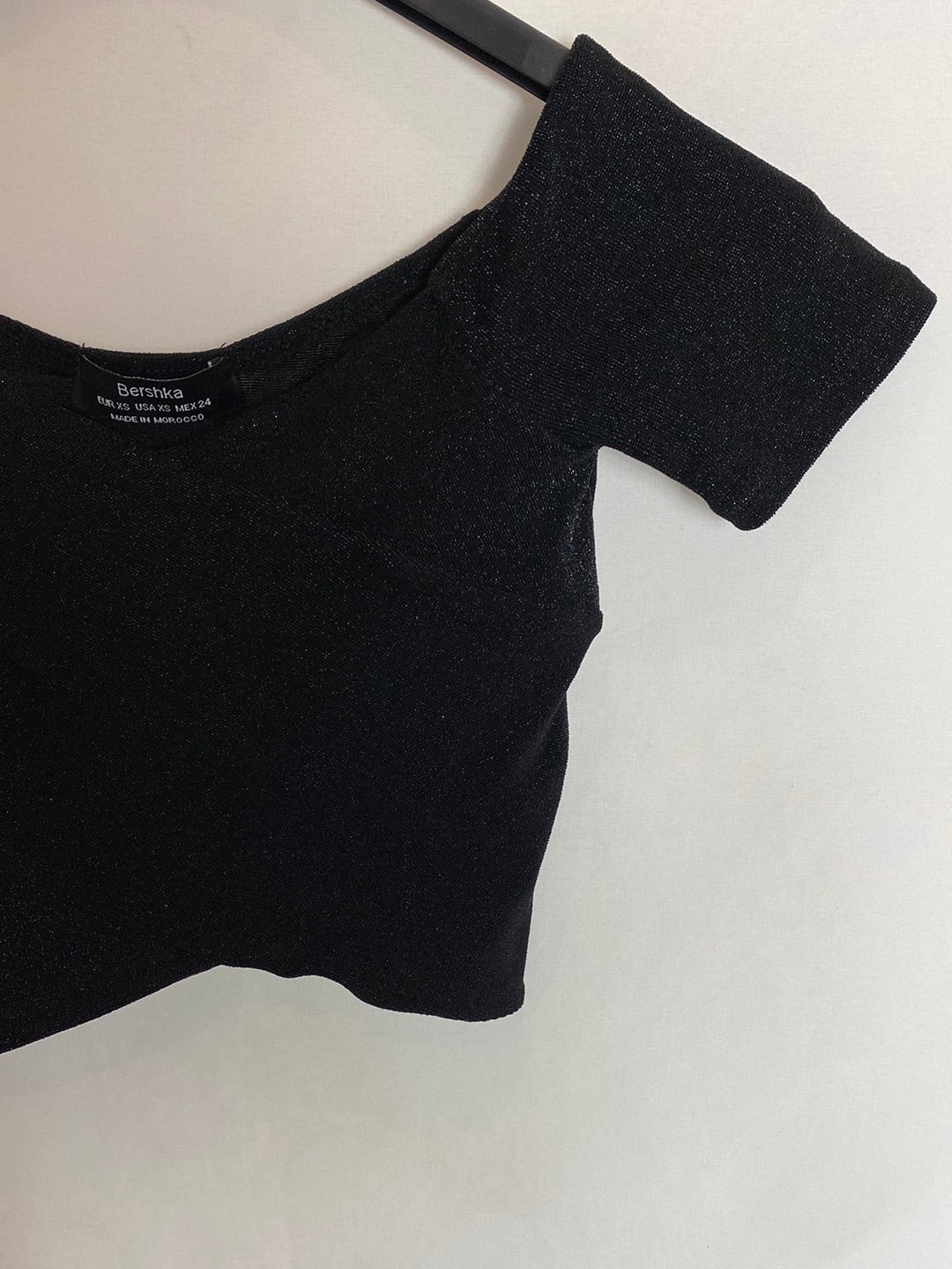 BERSHKA. Shiny black top. Size XS