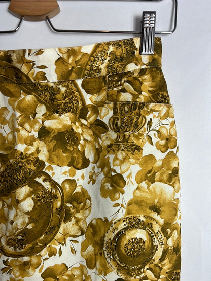 MIGUEL GIL. Falda corta estampada flores mostazas. T 40 (s)