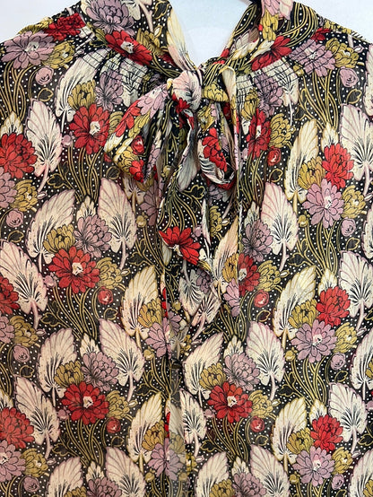 TOPSHOP. Blusa semitransparente apertura espalda. T 36