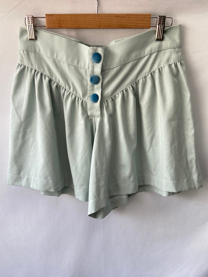 BELAQUE.Bermuda tono pastel detalle botones. T.S