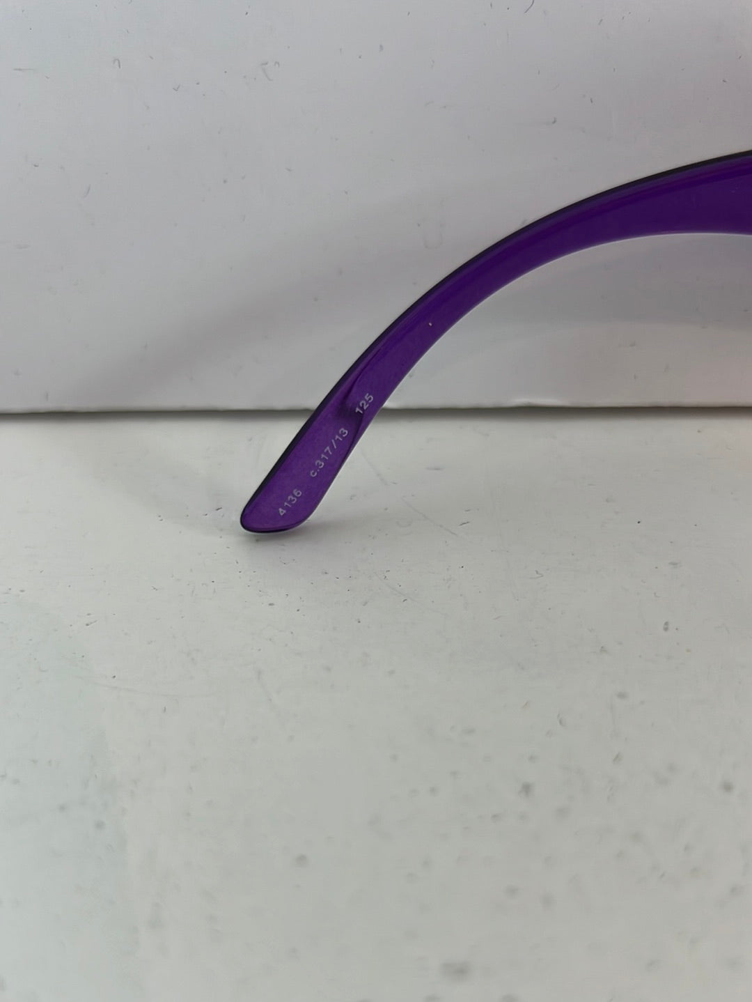 CHANEL. Purple-rimmed glasses