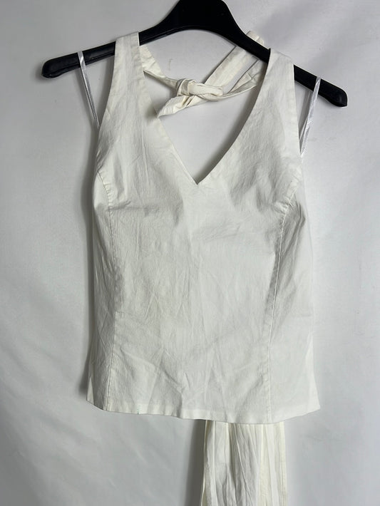 LACE. White top with a bow at the neck and back. Size 40