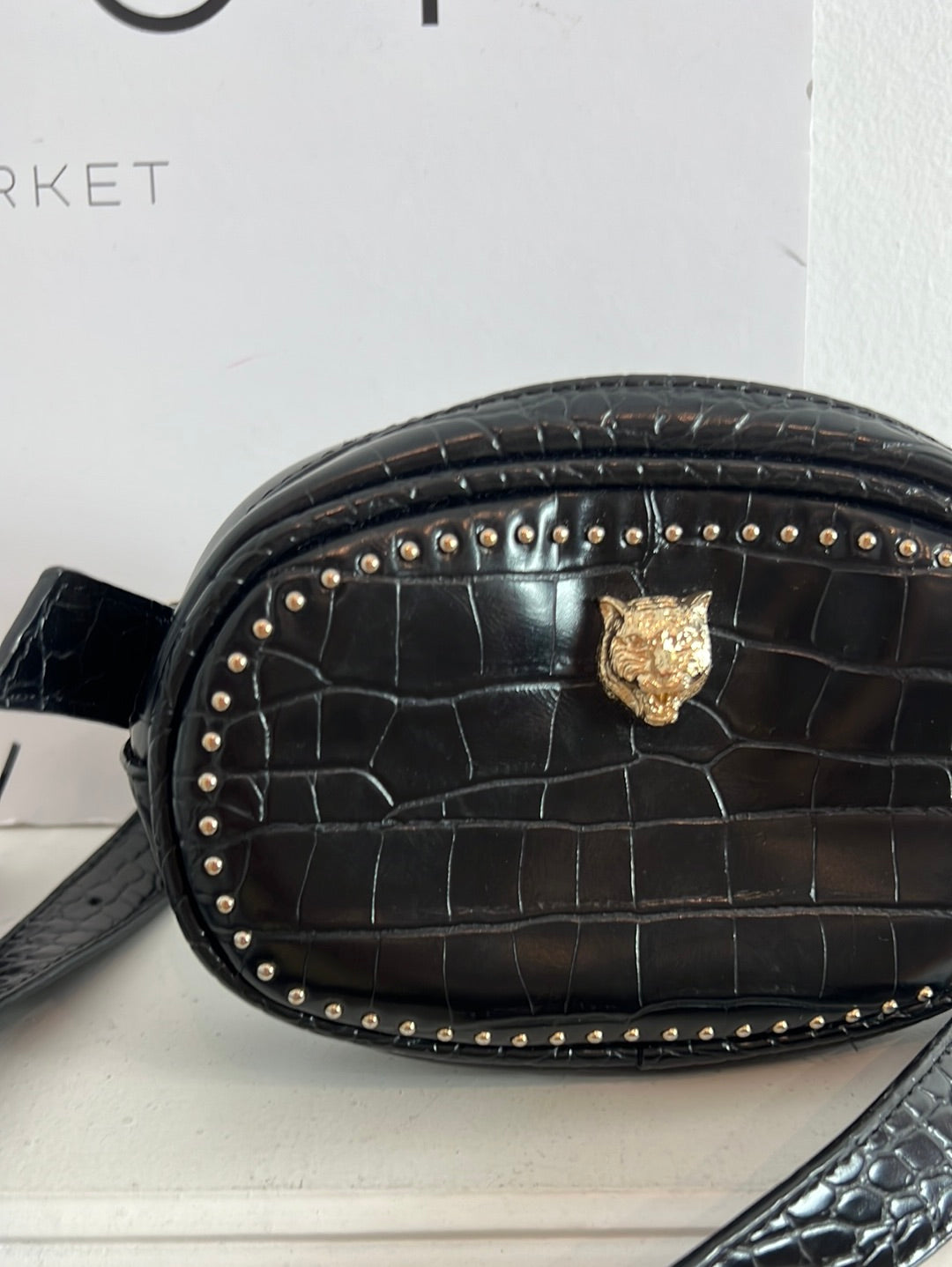 OTHER. Black fanny pack with details