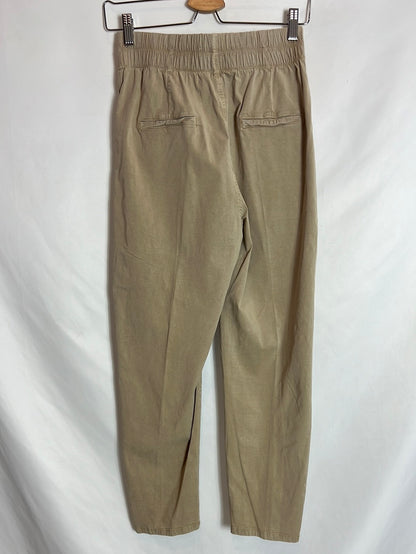 OTHER. Beige slouchy button-down pants. TS