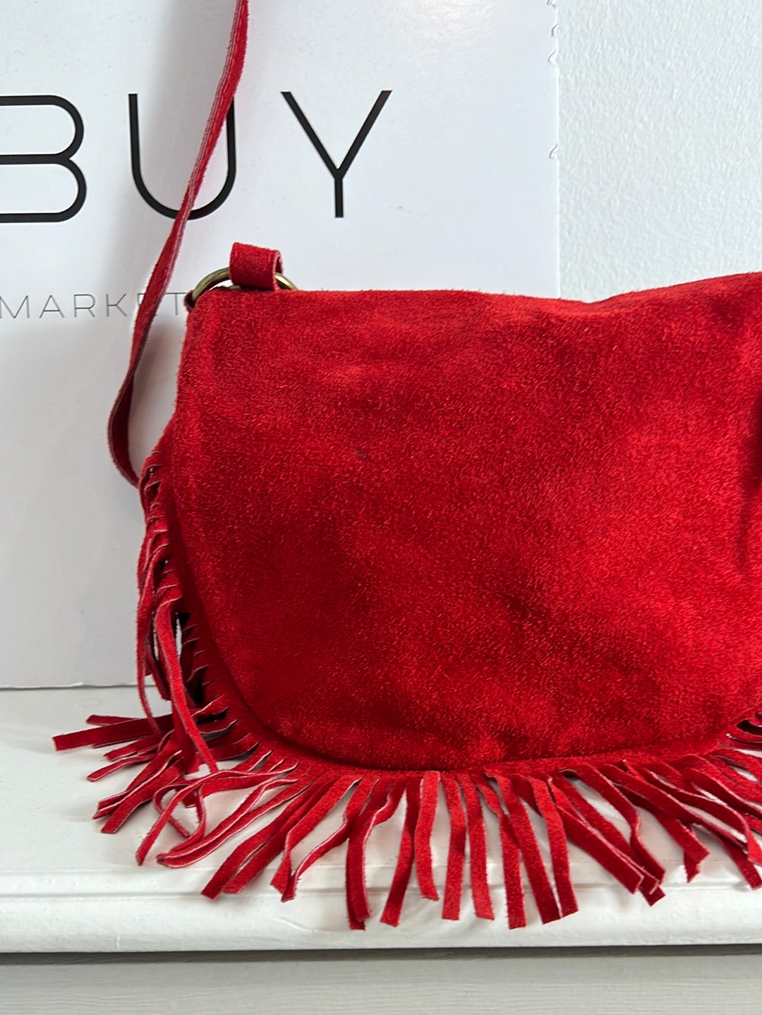 OTRAS. Bolso piel rojo flecos