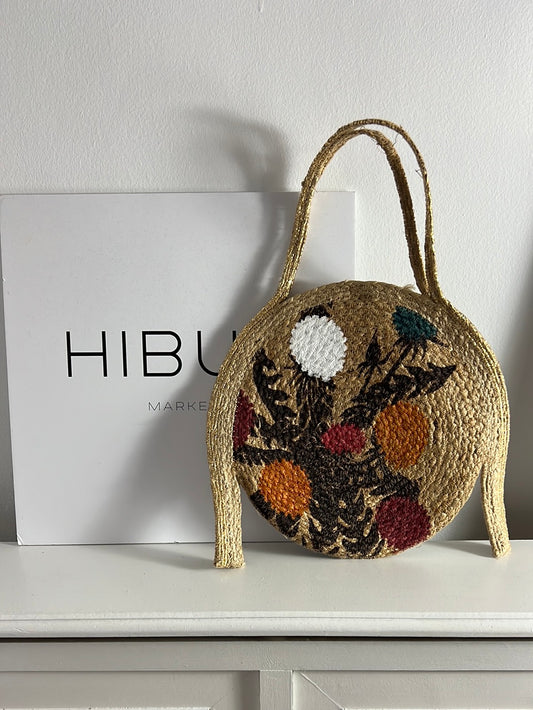 OTRAS. Bolso rafia redondo estampado