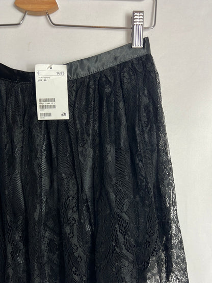H&amp;M. Short black lace skirt. Size 38