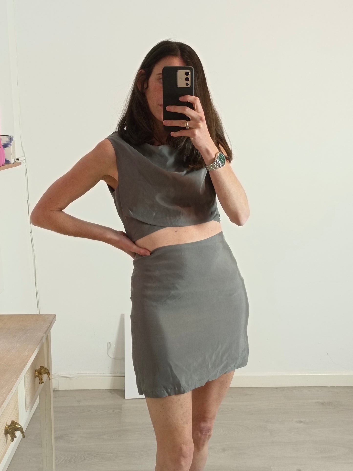 BY NIUMA. Gray textured dress with openings. T.S.