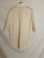 H&M. Camisa beige impermeable T.xs (oversized)
