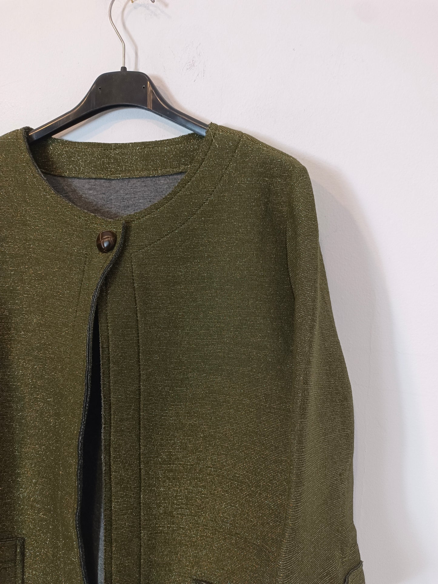 OTHERS. Green jacket with thread details YOUR(S)