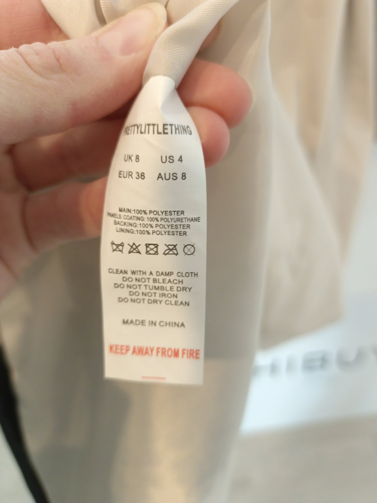 PRETTYLITLETHING. Beige trench coat with black details, size 36