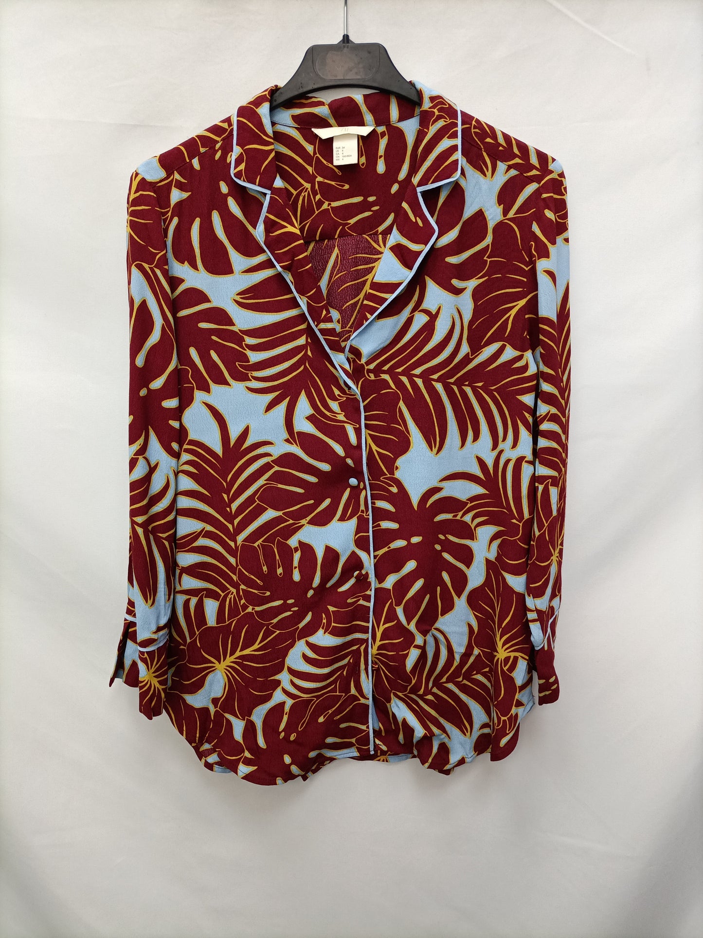 H&M. Blusa flores hawaianas T.34.