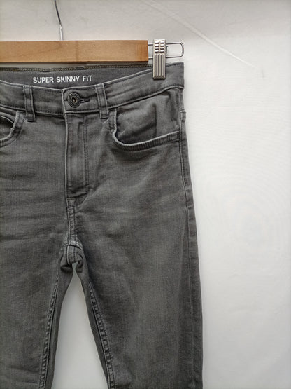 ZARA. Pantalón gris pitillo T.11/12