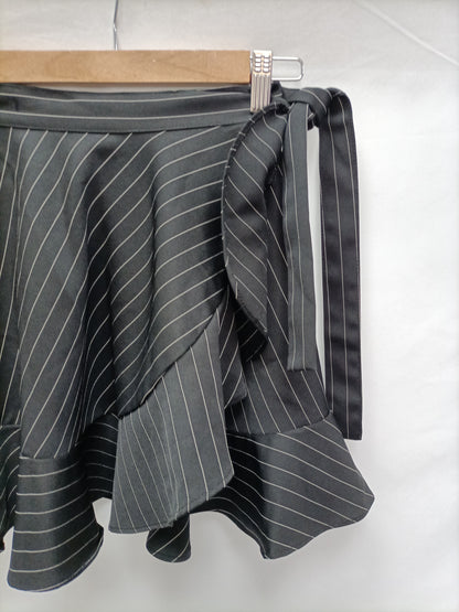 STOREST. Falda rayas volante T.32