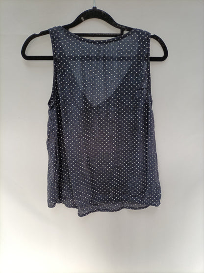 THAT ONE OR THAT ONE. Blue polka dot top T.xs