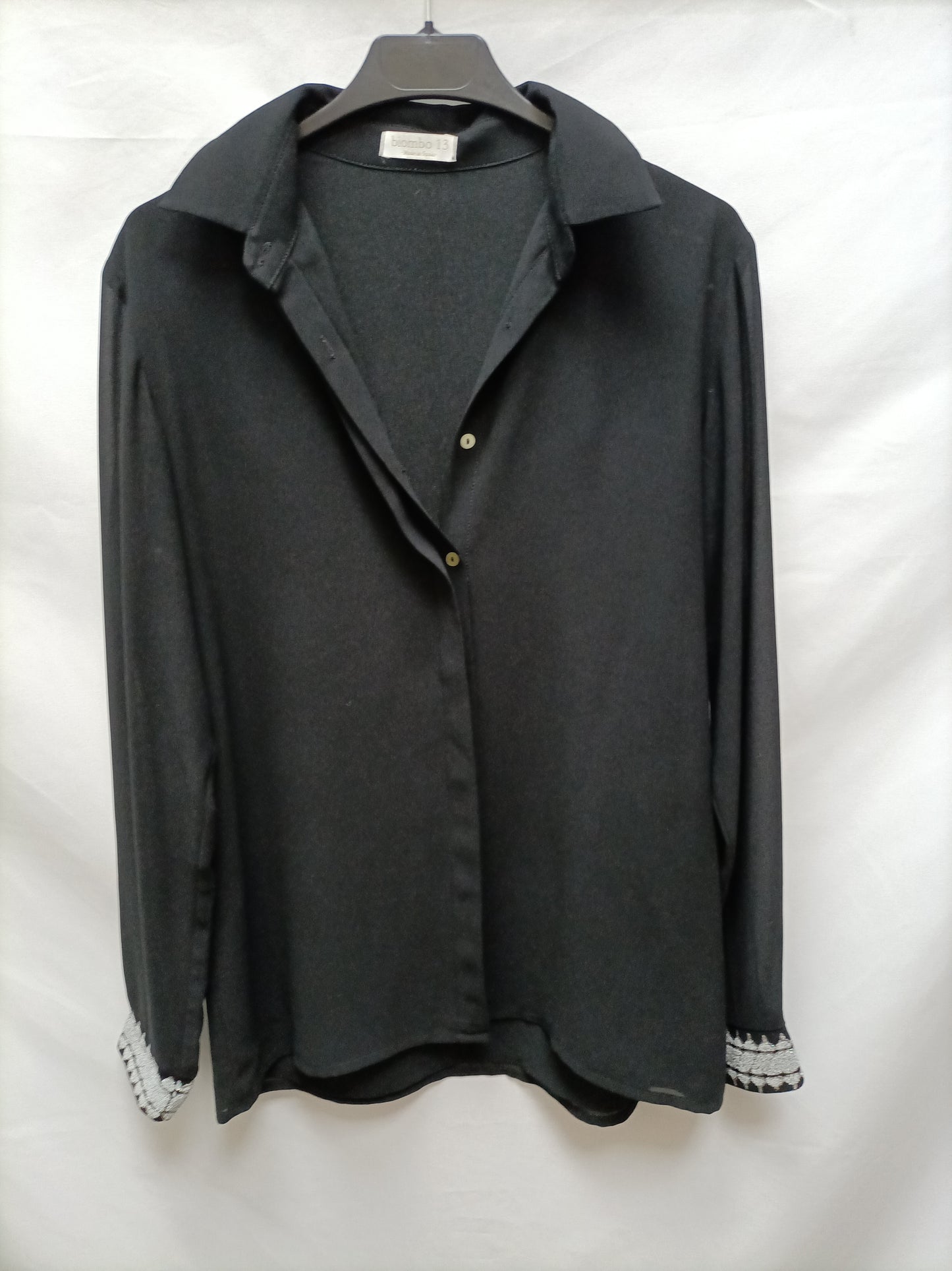 BIMANI. Black blouse with cuffs