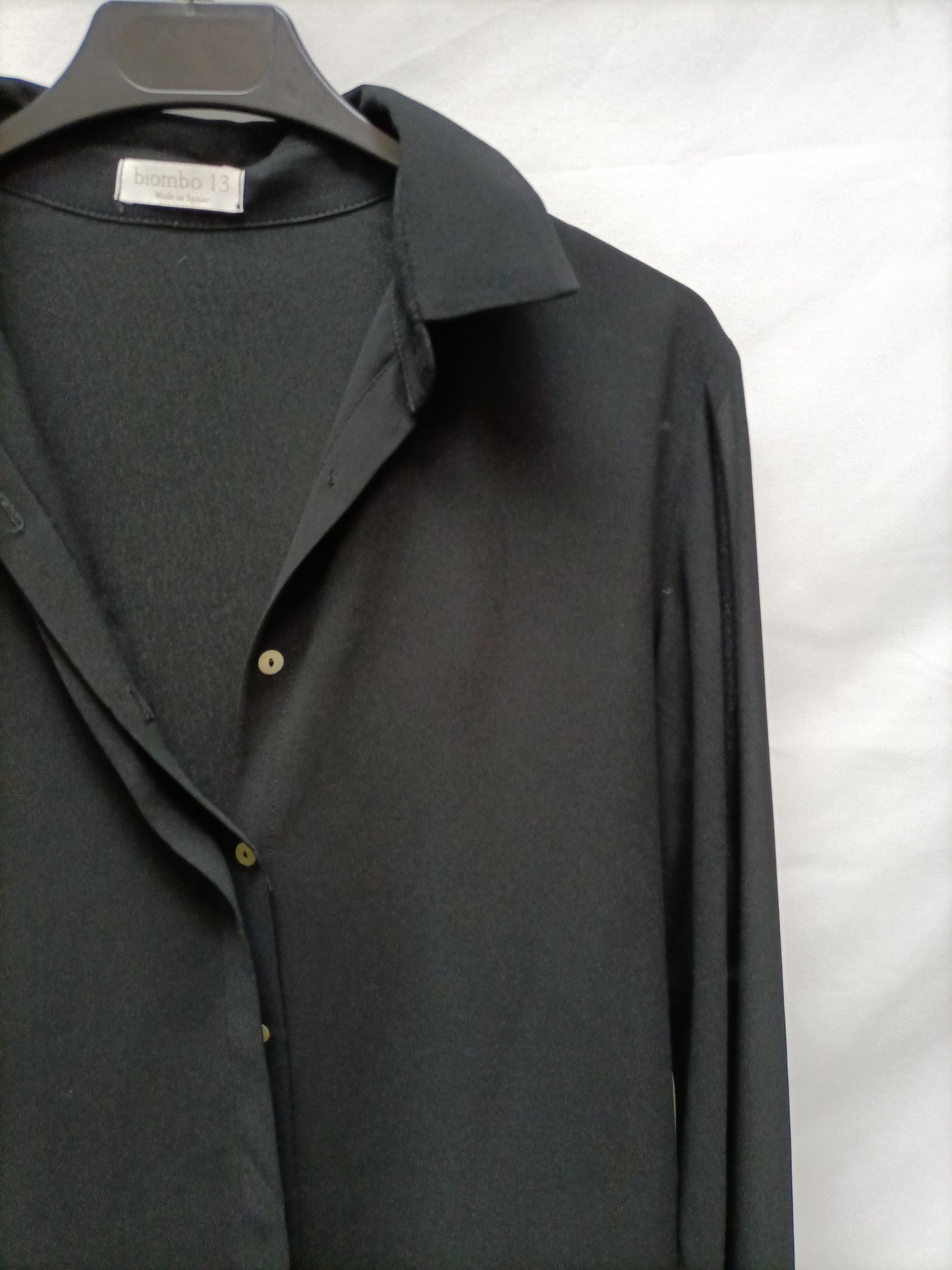 BIMANI. Black blouse with cuffs