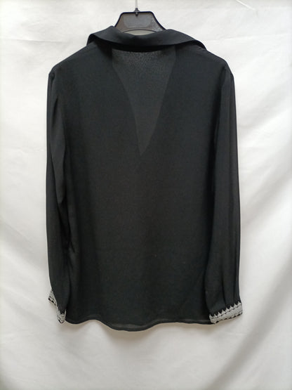 BIMANI. Black blouse with cuffs