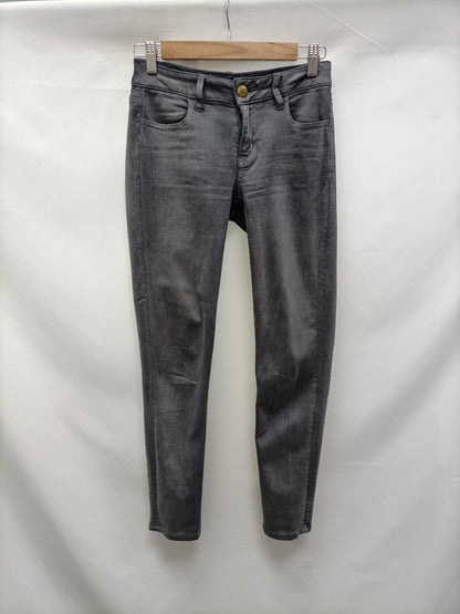 AMERICAN EAGLE. Jeans grises pitillo T.36