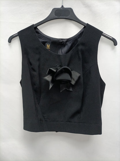 MOK. Total look pantalon de vestir y chaleco negro detalle lazo T.42