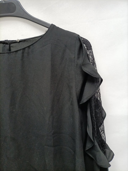 OTRAS. Blusa negra volante T.u(s)