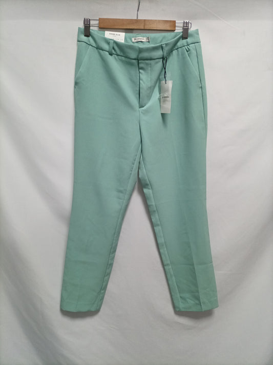 STRADIVARIUS. Aqua green chino trousers, size 38