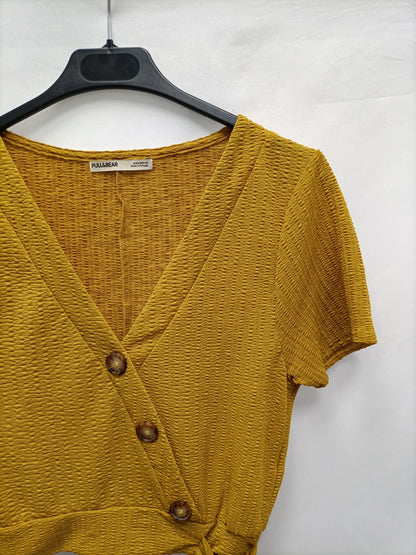 PULL&BEAR. Top cruzado botones T.s