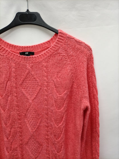 H&M. Jersey rosa ochos T.s