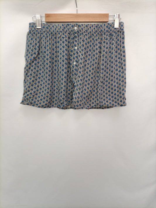 BROWNIE. Falda mini flores T.s