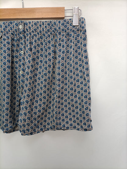 BROWNIE. Falda mini flores T.s