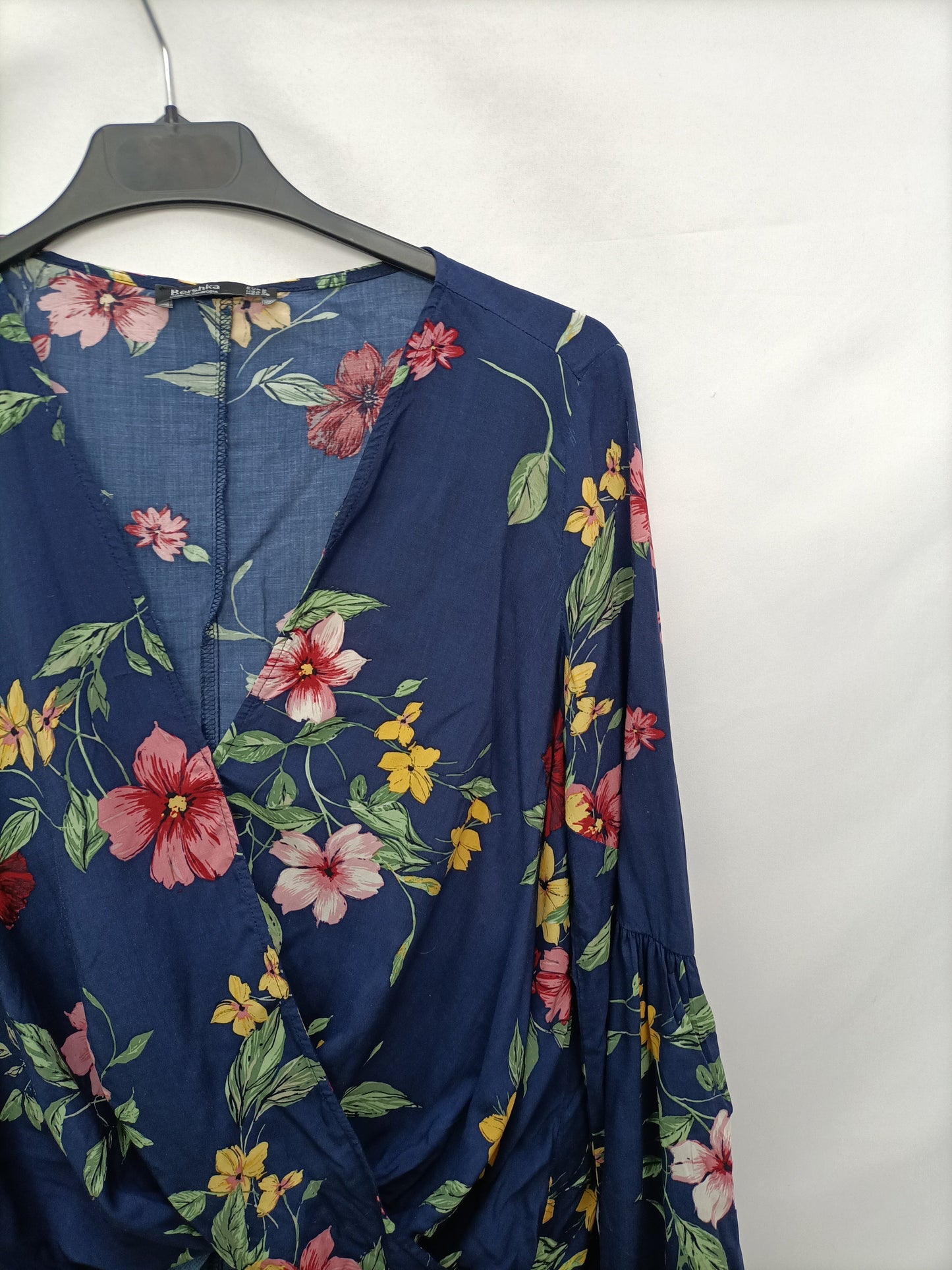 BERSHKA. Wrap blouse with Ts neckline