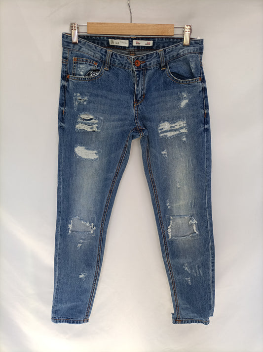 SFERA. Pantalón vaquero rotos T.36