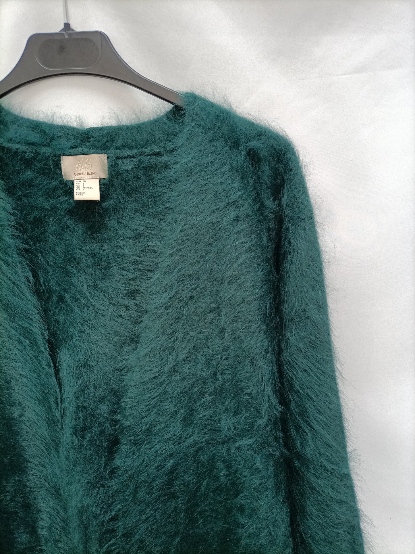 H&M. Cargidan de pelito verde T.38