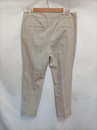 ZARA. Pantalón beige de vestir T.40