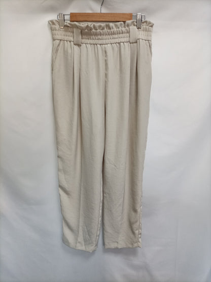 ZARA. Flowy beige trousers TL