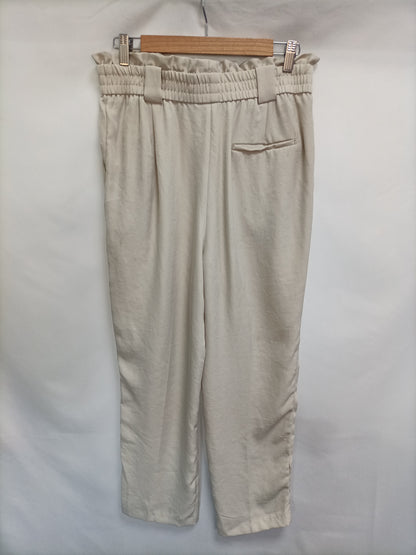 ZARA. Flowy beige trousers TL