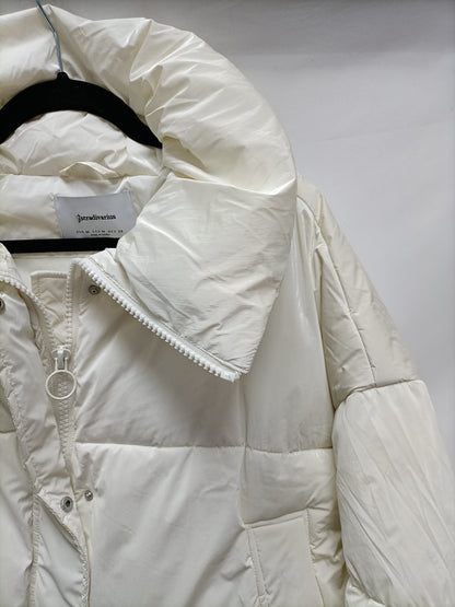 STRADIVARIUS. Plumas beige crudo T.m